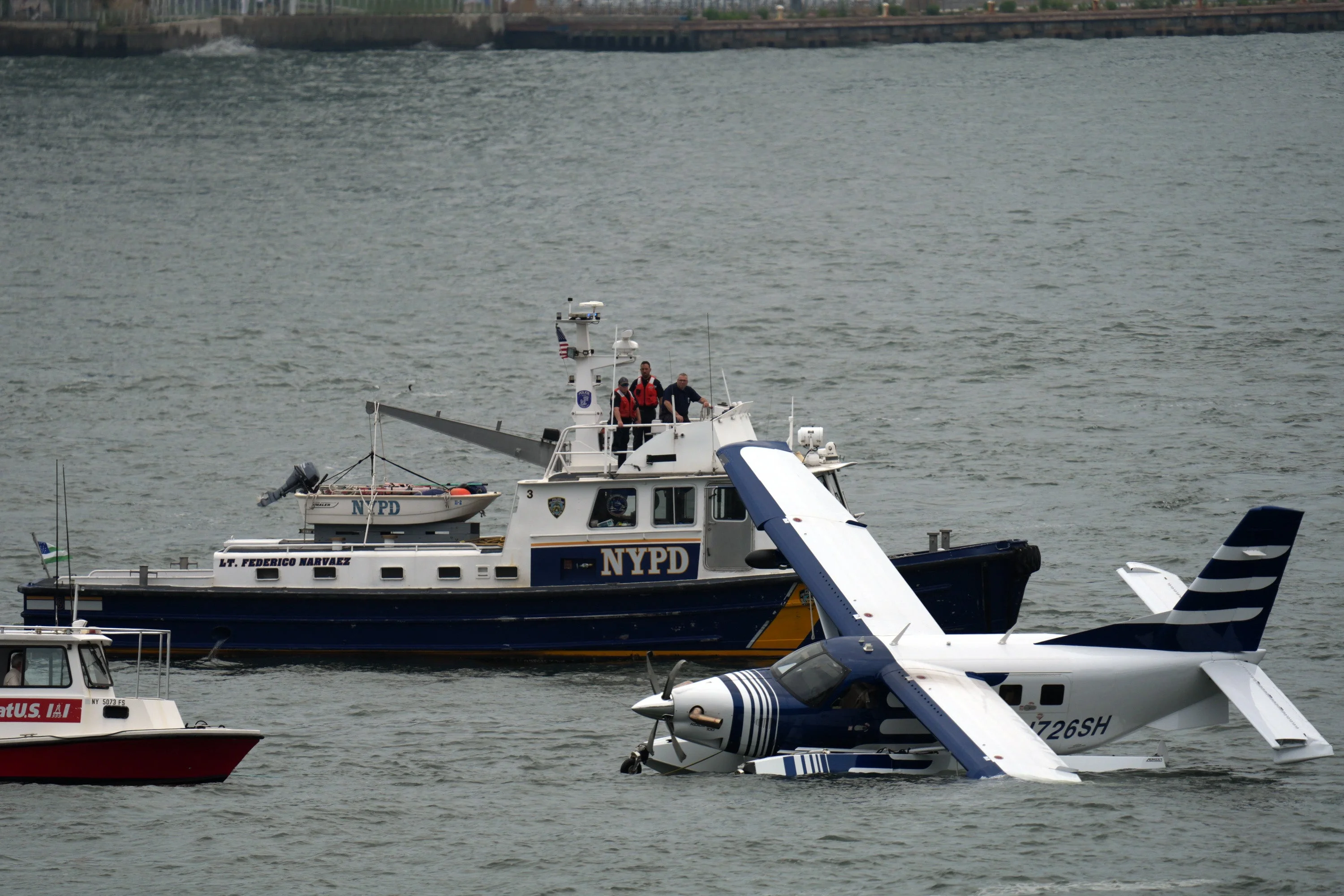 Crews rescued eight adults from the seaplane, including the pilot, police said