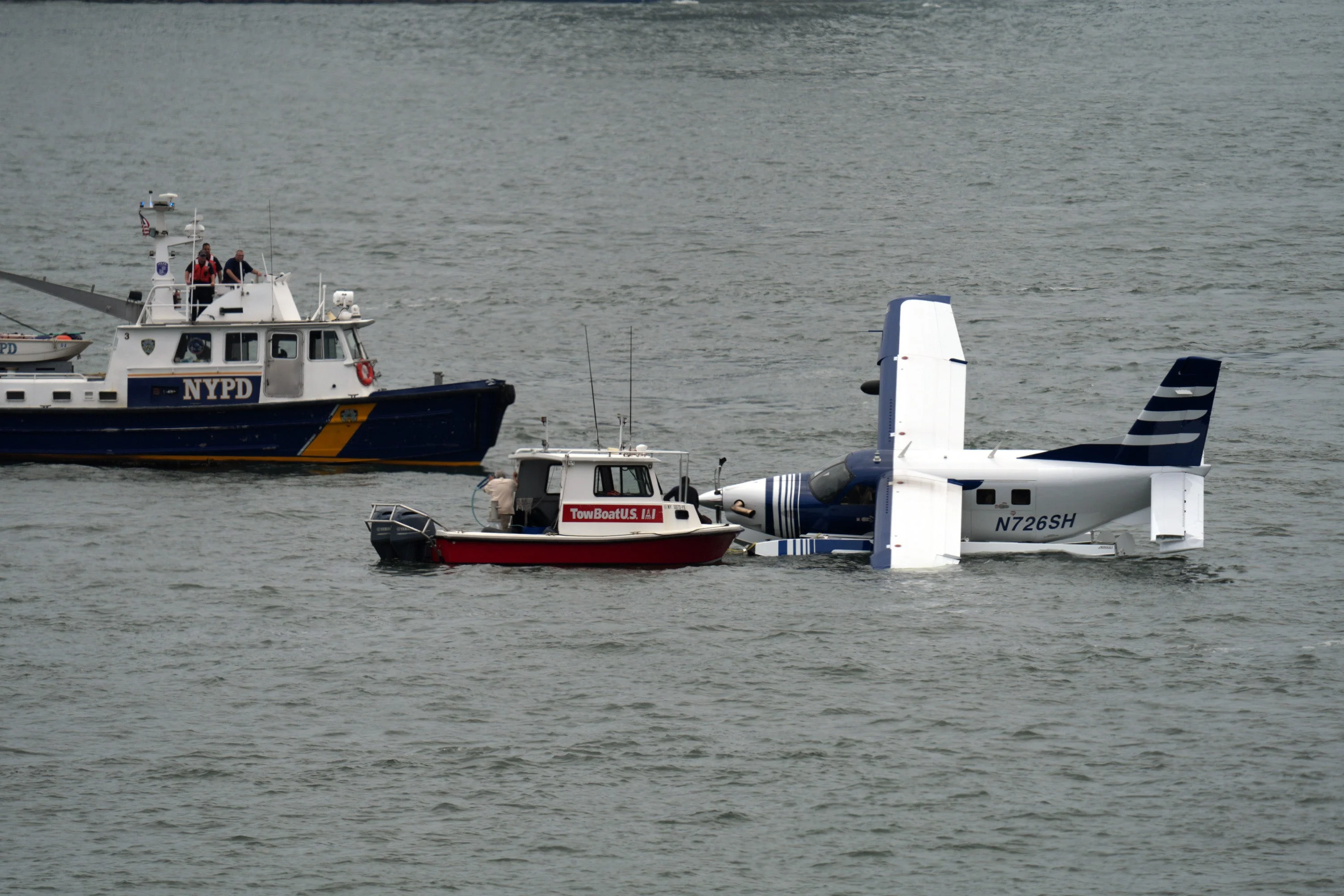 Crews are towing the seaplane back to the dock, fire officials said