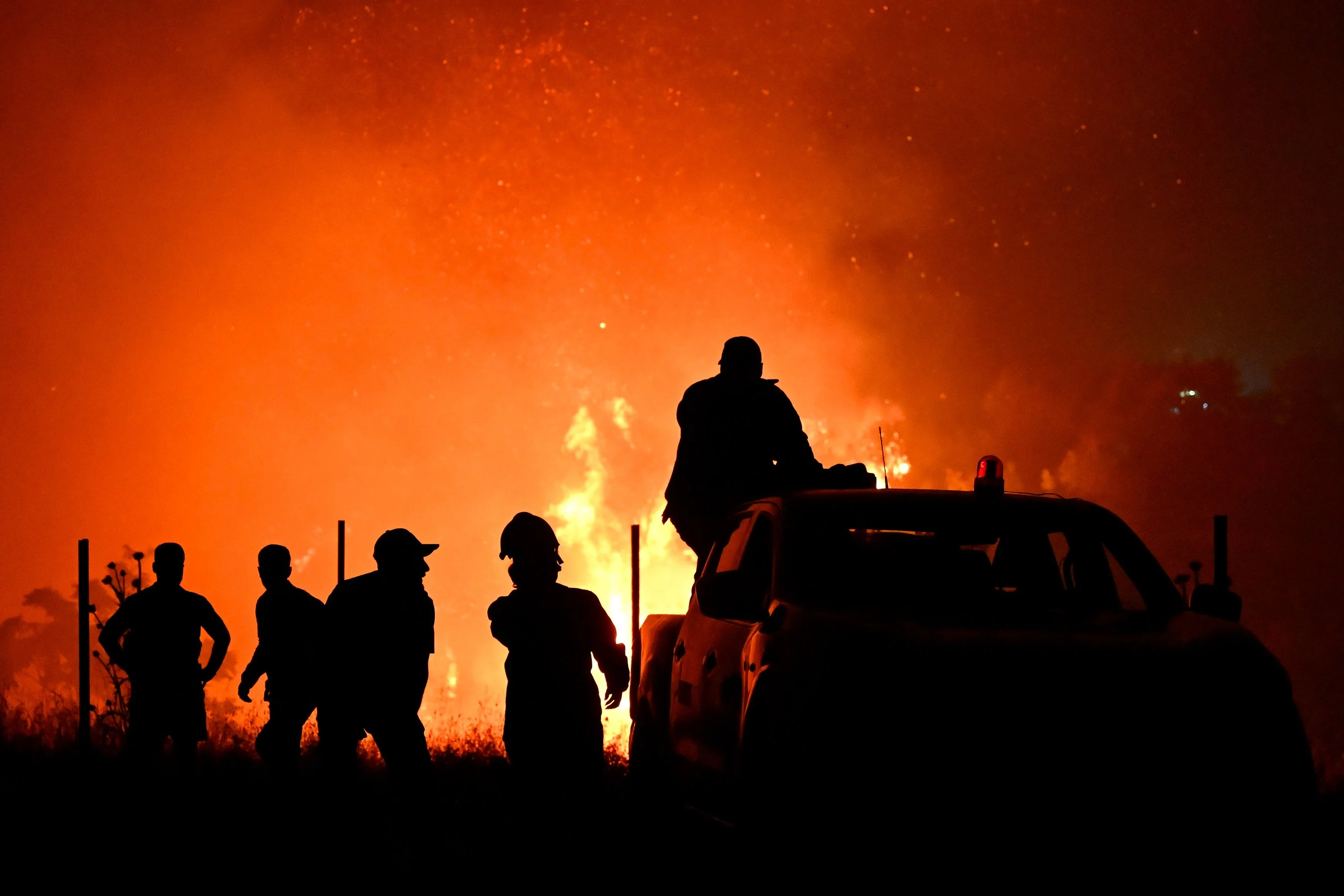 Firefighters at the front of a wildfire on the outskirts of the northern city of Thessaloniki