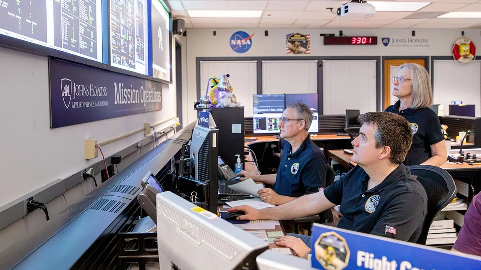 From left, flight controllers Mark Lahr and Josh Albers, and Mission Operations Manager Alice Bowman, monitor telemetry streaming from NASA's New Horizons spacecraft at the Johns Hopkins Applied Physics Laboratory in Maryland last month