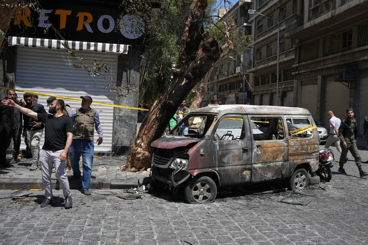 Syria says it arrested suspects behind the Damascus bombings during Macron's visit