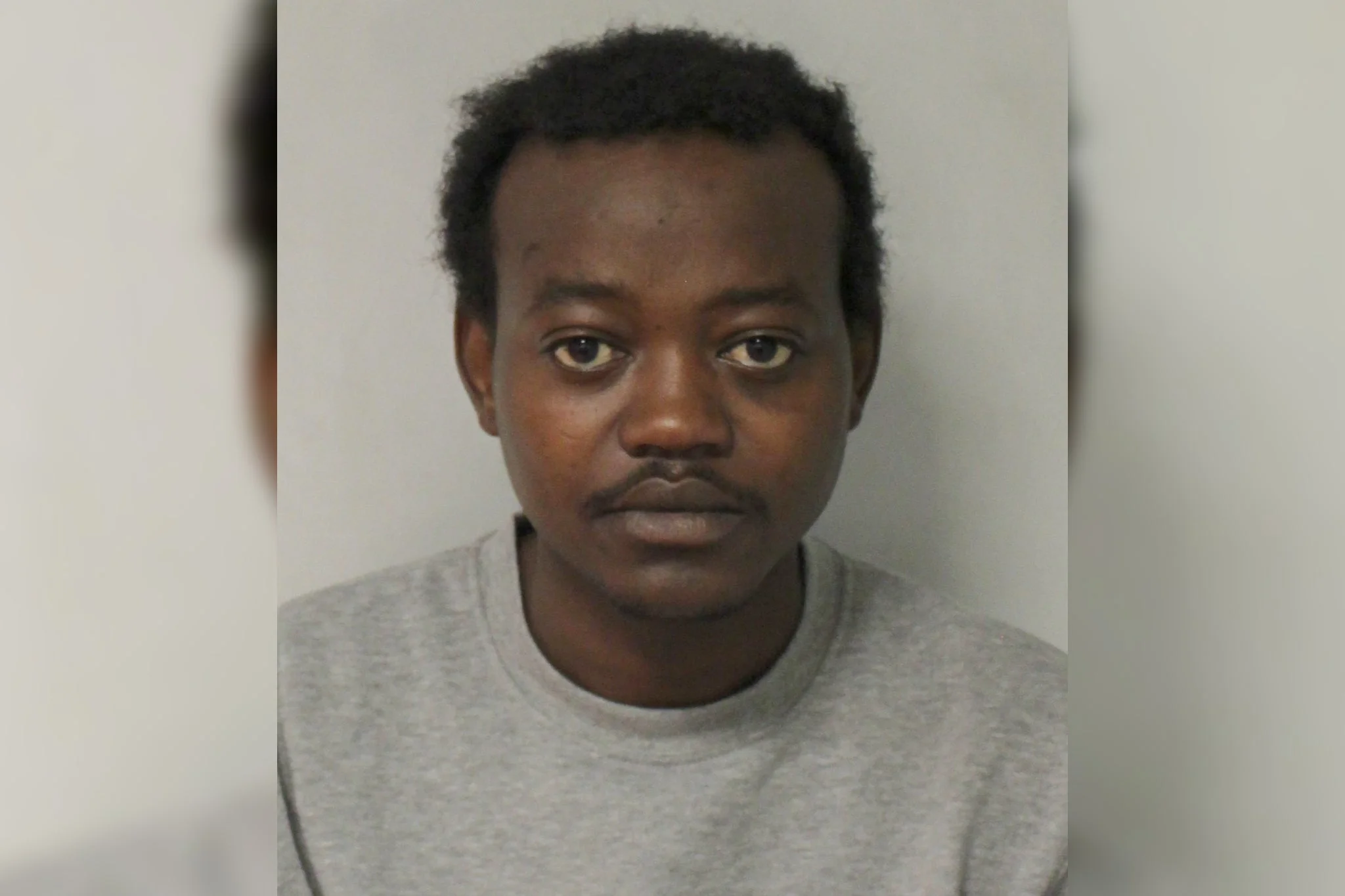 Rasheed Rahman after his arrest for murder