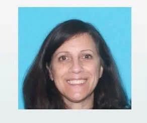 Karen Solomon, a 58-year-old Massachusetts woman who wrote a book about police officers’ good deeds, is wanted in connection with the death of a cop inside her home