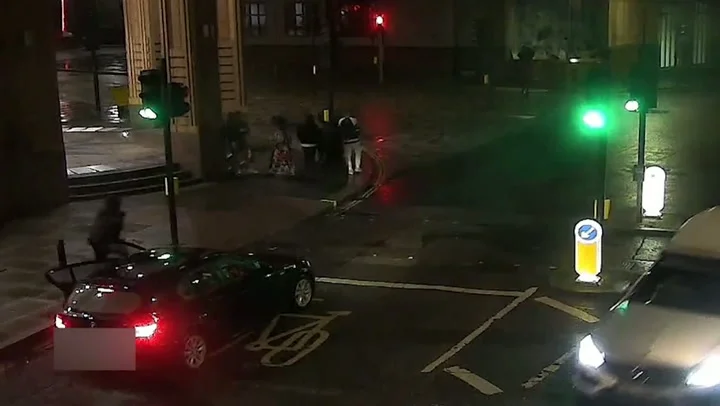 Moment knife-wielding gang members emerge from BMW before attacking four people and stealing watches