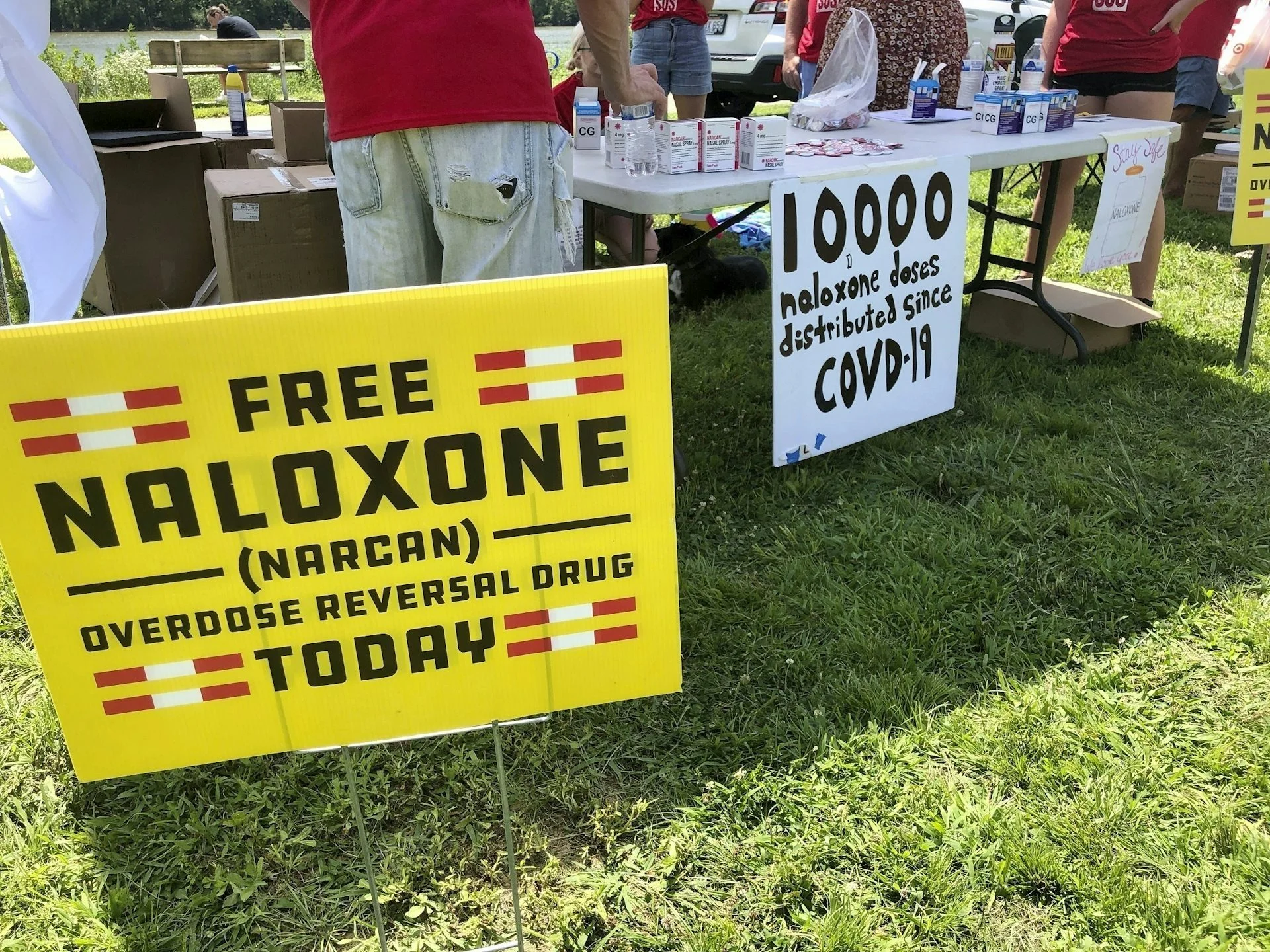 Signs are displayed at a tent during a health event in 2021 in Charleston, W.Va.