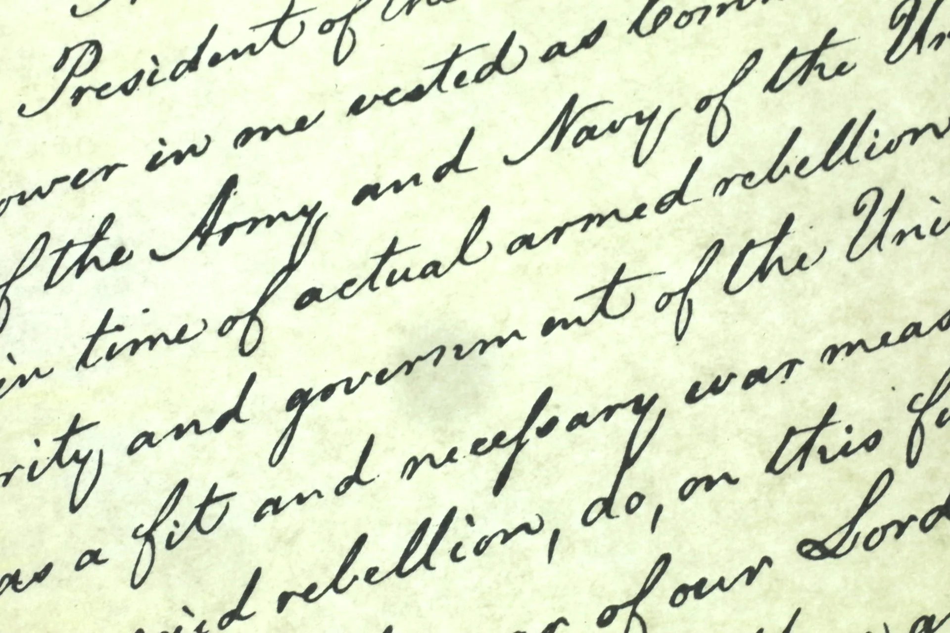 Cursive writing is seen covering a yellow piece of paper.